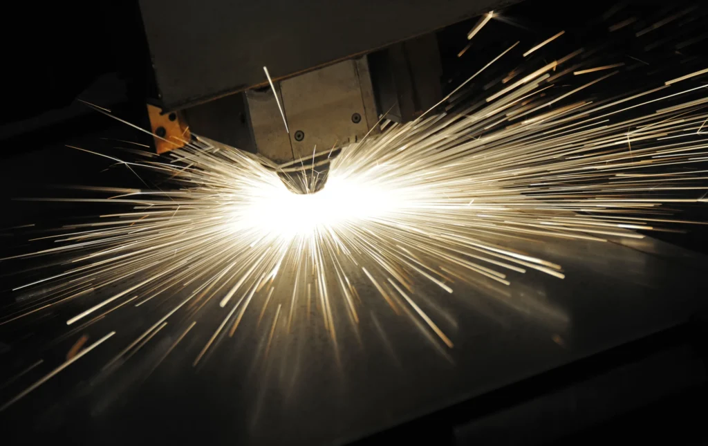 What is a laser cutting machine shown cutting sheet metal