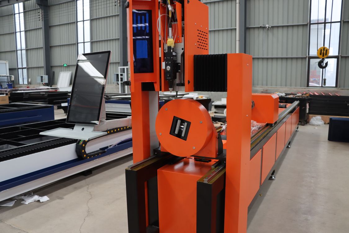 An industrial fiber laser tube cutter on a factory floor between maintenance intervals