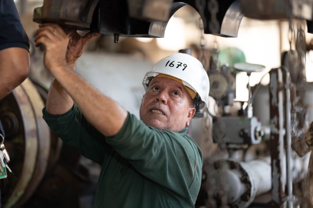 Maintenance technician inspecting an industrial machine