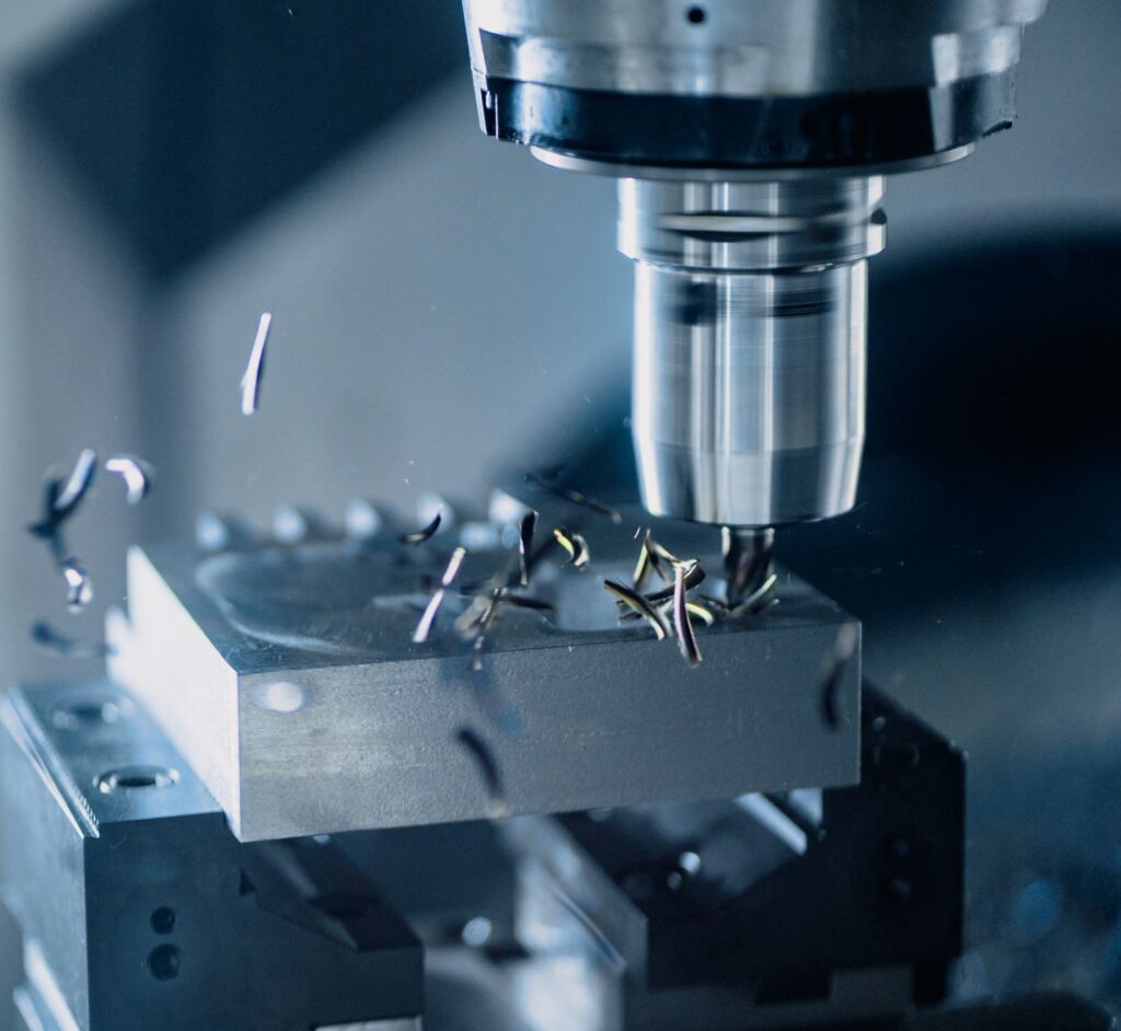 Close-up of precision metal cutting held to tight tolerances