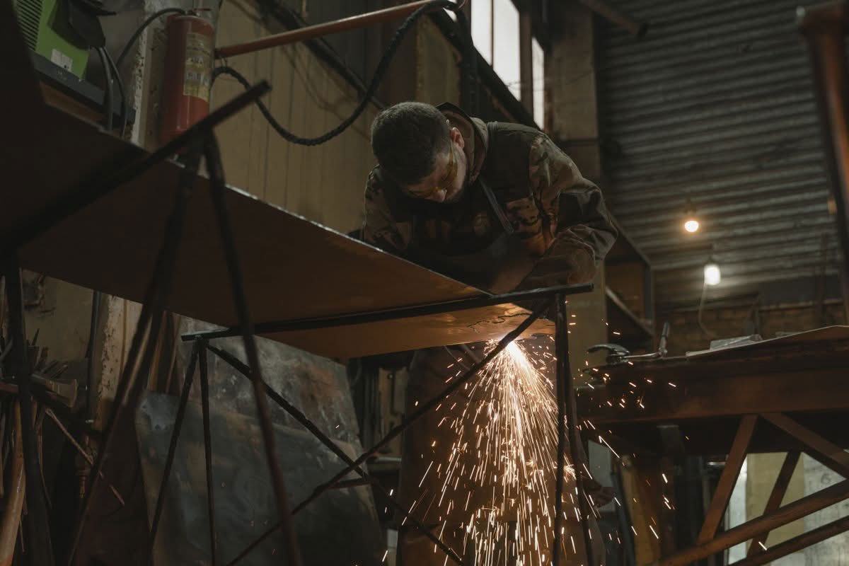 Machine operator working at a fabrication shop bench