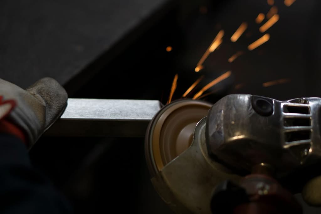 Metal grinding sparks in a fabrication shop