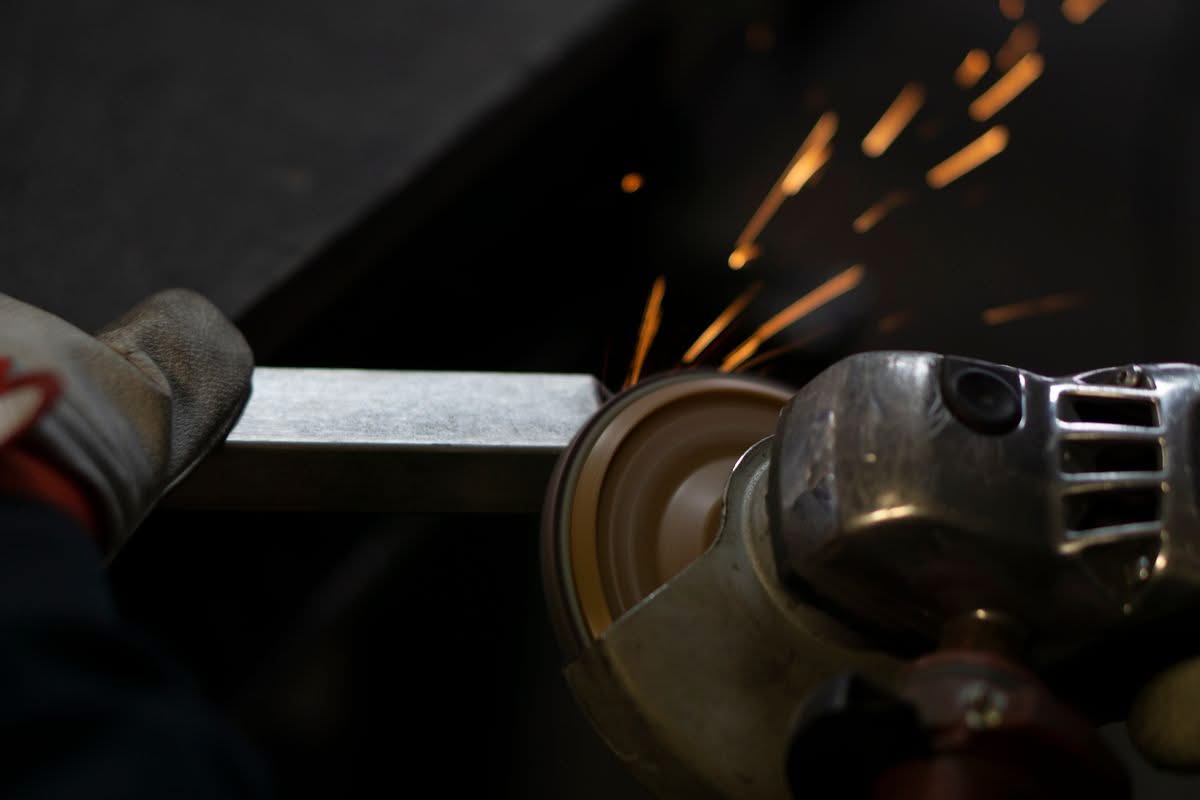 Metal grinding sparks in a fabrication shop