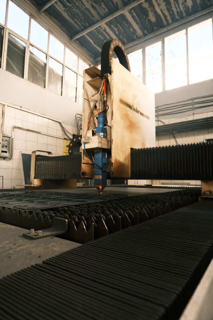CNC cutting machine in an industrial setting, the kind of equipment worth inspecting under power before buying used