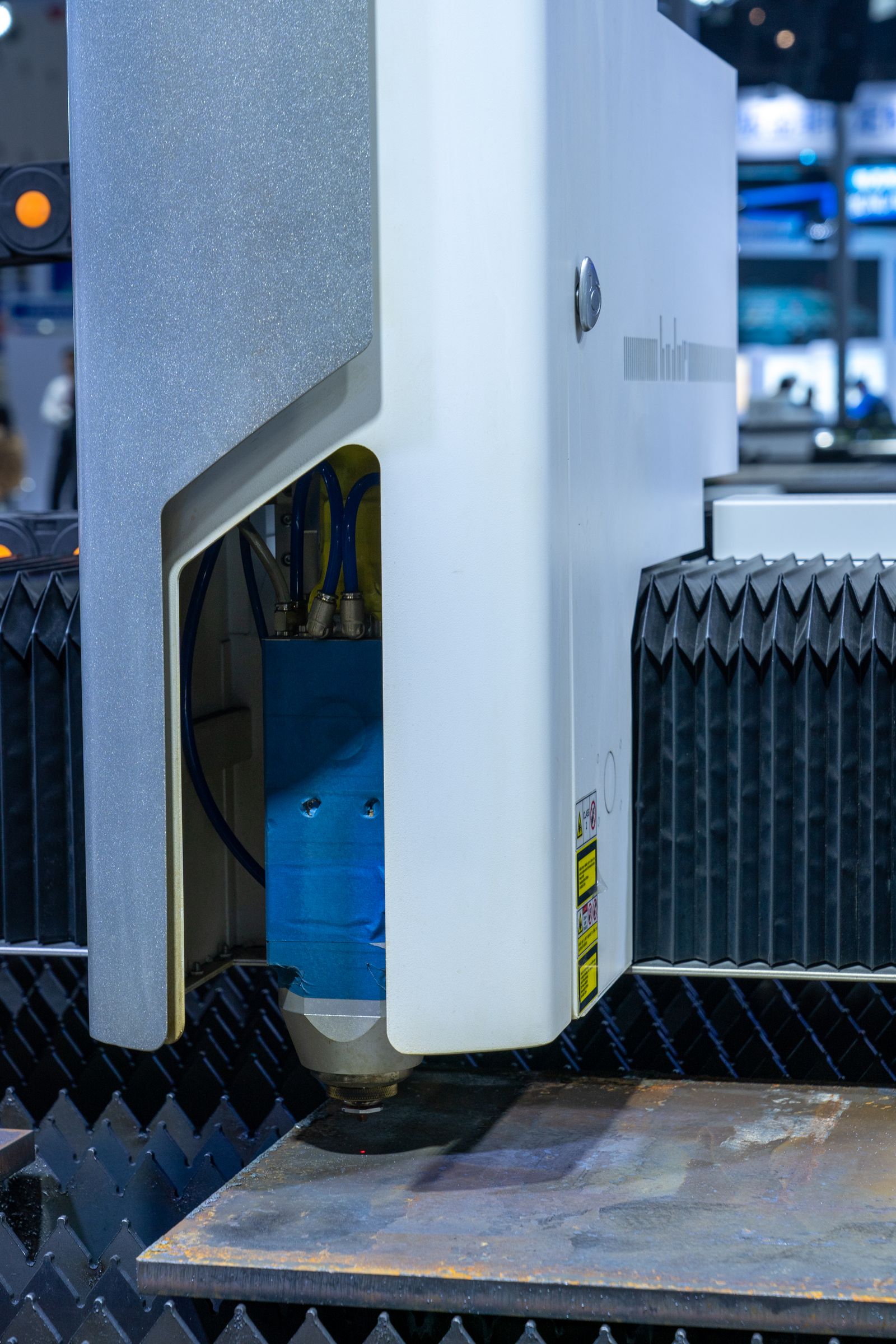 Enclosed fiber laser cutting cell, where fume extraction matters most when cutting coated steel
