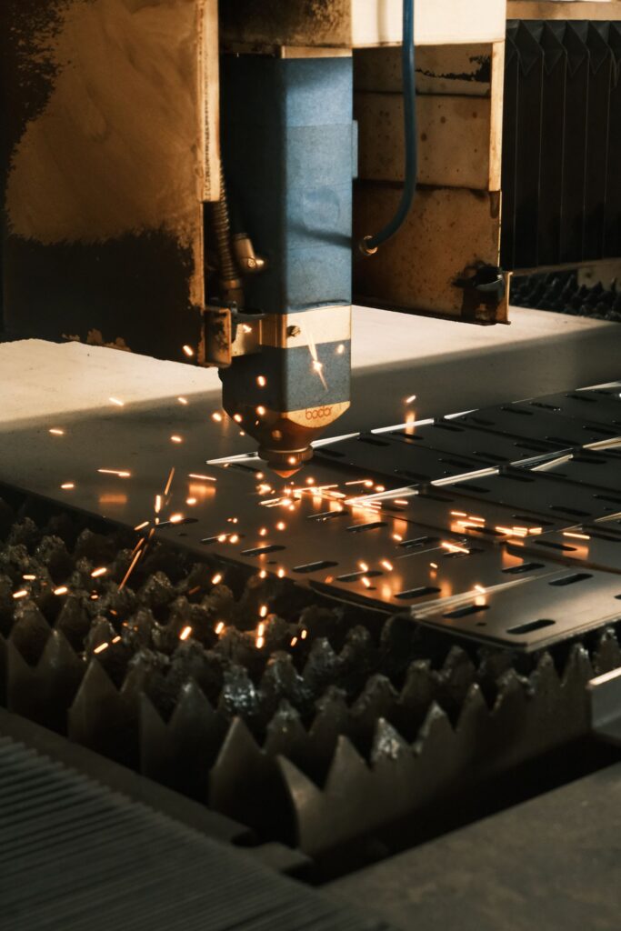 Fiber laser cutting head starting a cut on plate, where fiber laser piercing problems show up first