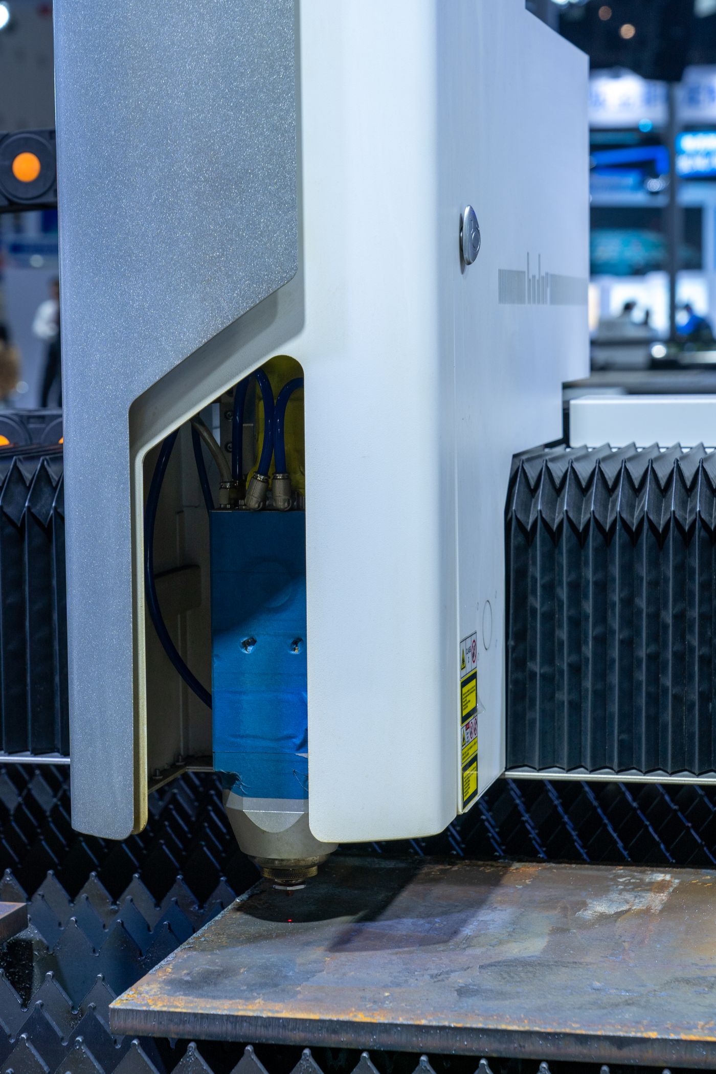 Industrial laser cutting machine in operation, where a weak resonator shows up first as slower cutting and inconsistent edges