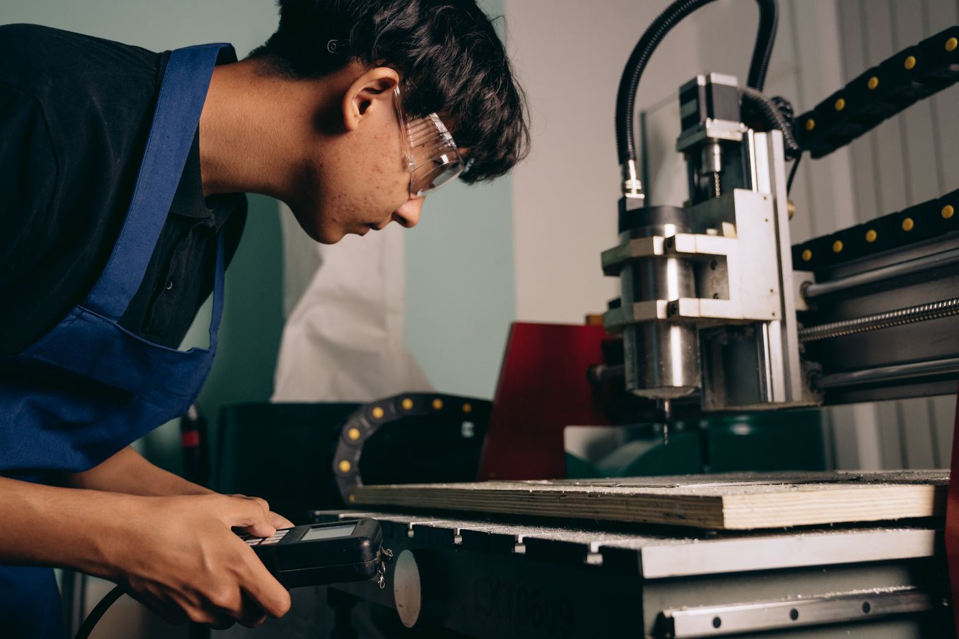 Machine operator wearing safety glasses while running equipment, the person who owns the laser shift start checklist