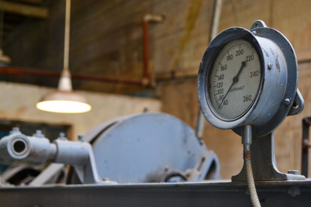 Close-up of a manual pressure gauge, one of the readings to log when checking a laser chiller coolant loop